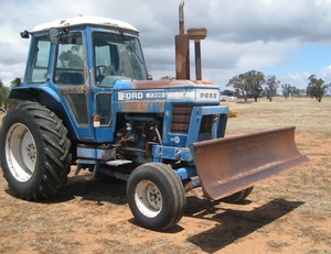 Ford 7700 Tractor with Forks