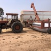AKron E180 grain bag outloader  and MF 188 tractor 