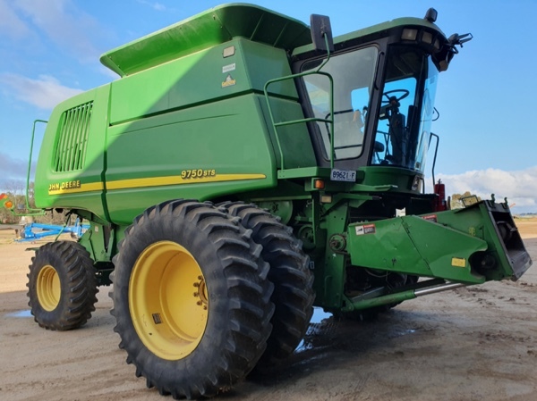 JOHN DEERE 9750 STS WITH 936D 36 FOOT DRAPER FRONT ON TRAILER FOR SALE