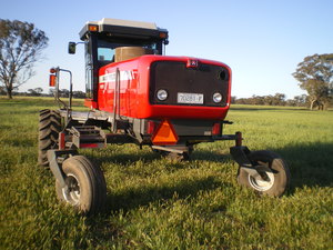 Massey Ferguson 9635 Windrow Tractor 2009 with 16 ft Razor Bar 4 Steel Roller Conditioner Front. 2012