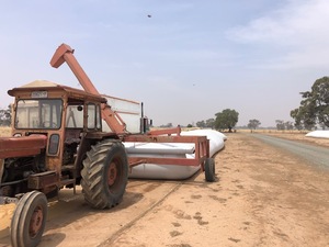 AKron E180 grain bag outloader  and MF 188 tractor 