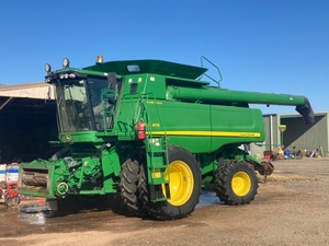 John Deere 9770 with 2016 40’ D65 MacDon Front on Coolaman Trailer