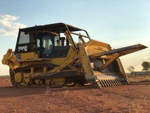 Komatsu Bulldozer with Gessner Stick rake and tree spear