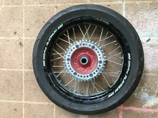 Motorbike front and rear wheels and road tyres