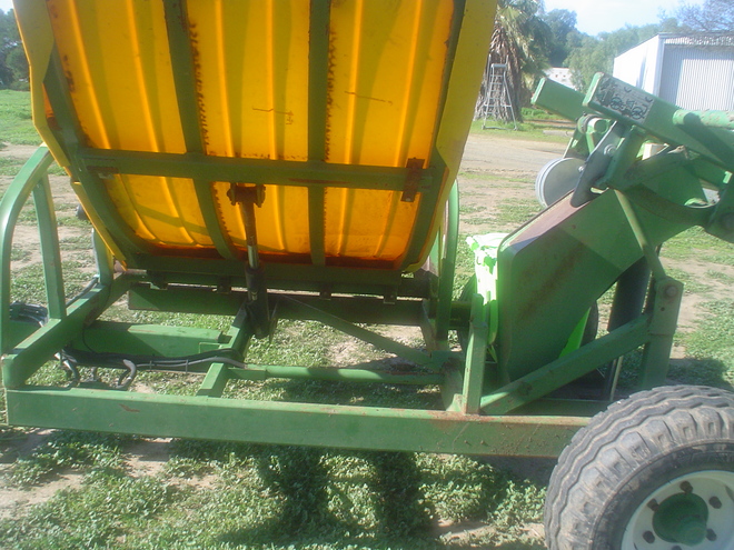 Hustler 4000 Round  and Square Bale Hay Feed out Machine . 
