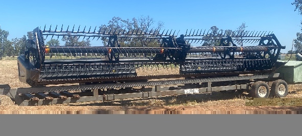 2015 MacDon 205 (with 2 fronts & trailers) and 1994 International S-line Prime Mover Package