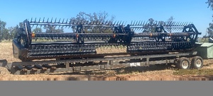 2015 MacDon 205 (with 2 fronts & trailers) and 1994 International S-line Prime Mover Package