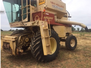 New Holland TR85 Header Harvester (In working Condition) + one available for parts (front & trailer included)