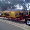 2010 Phillips Rollerdown Pickup Canola Front with trailer