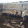 Under Auction - (A153)  Case WDX 1701 Windrower with 30ft Case / Honeybee Front on Comb Trailer 
