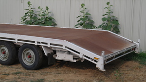 Tri axle beaver tailed trailer