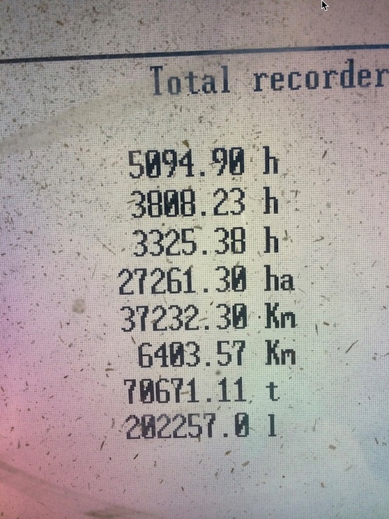 Cat Lexion 480 R including MacDon 962 front and trailer.