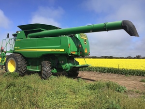 JOHN DEERE 9670 STS COMBINE HARVESTER .. 45’ Honey-Bee front with 8 wheel trailer