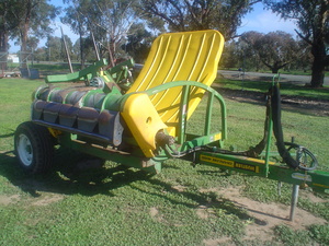 Hustler 4000 Round  and Square Bale Hay Feed out Machine . 