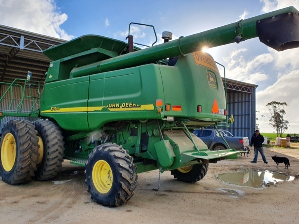 JOHN DEERE 9750 STS WITH 936D 36 FOOT DRAPER FRONT ON TRAILER FOR SALE