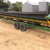 John Deere 930 Flex Front , Lentil Reel , and Finger Reel , on a good Comb Trailer 