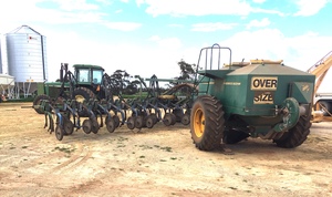John Deere 40 Foot 12 inch space air seeder with Simplicity Air Cart.